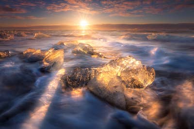 It's possible to get up close to ancient pieces of glacier ice on the Diamond Beach, an impressive stretch of black sand where icebergs from Jökulsárlón wash up with the surf.