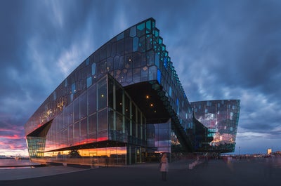 Harpa Concert Hall stands by the harbour in downtown Reykjavík and its architecture is extremely impressive.
