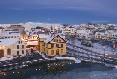 In the wintertime, the pond, Tjörninn freezes over completely and some locals like to go skating on it.