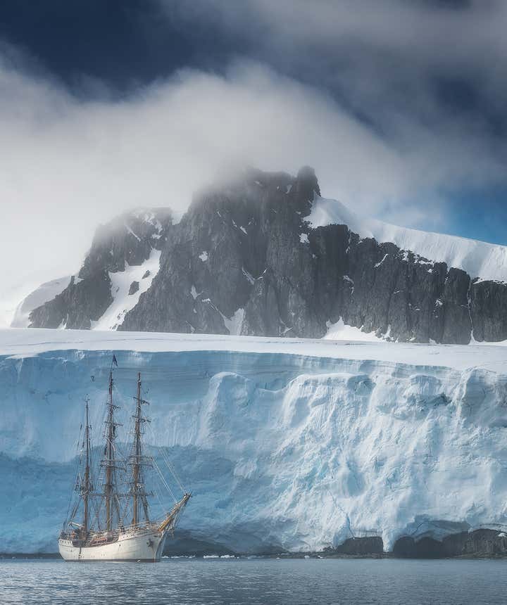 The Greg Mortimer sails along the Antarctic ice shelf.
