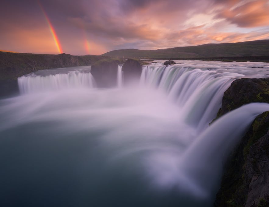 A waterfall that looks like cotton wool due to a long exposure in the icelandic landscape - Iceland Photography | Everything You Need To Know