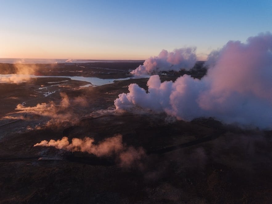 Steam from Geothermal pools raise from the Icelandic landscape - Iceland Photography | Everything You Need To Know