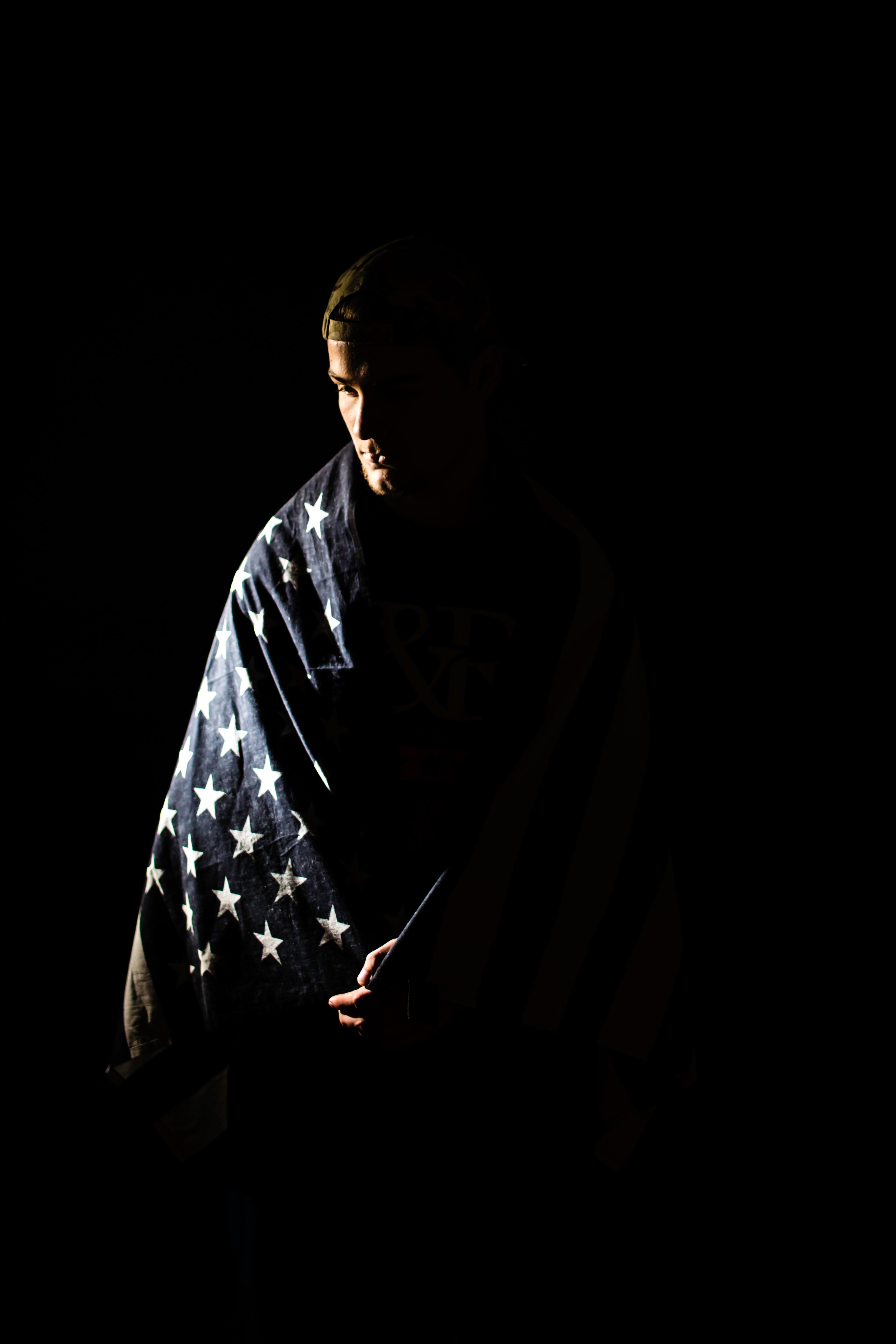 Man draped in stars on a flag