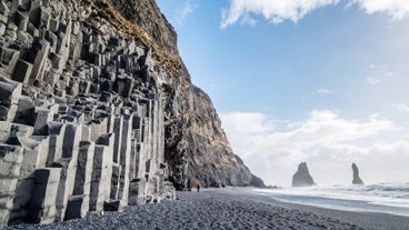 Majestic basalt stacks against the backdrop of Reynisfjara beach.