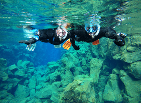 Experiencing pure bliss as they explore the breathtaking underwater world of Silfra.