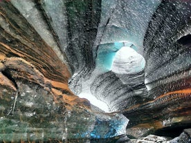 Intricate patterns and textures carved into the walls of the enchanting Katla Ice Cave.