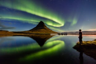 Kirkjufell mountain on the Snaefellsnes Peninsula looks stunning under the northern lights.