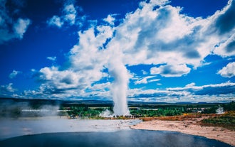 Powerful geothermal activity at the Geysir geothermal area, where erupting hot springs showcase nature's forces.