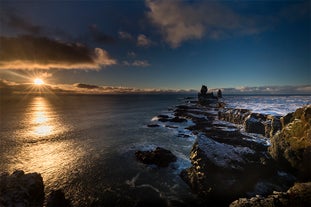 Majestic and mysterious, the towering Londrangar basalt cliffs stand as ancient sentinels on Iceland's rugged coastline.