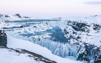 Experience the winter magic at Gullfoss, as the mighty waterfall freezes into a captivating icy spectacle.