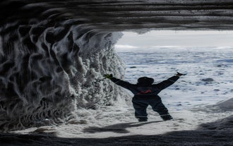 Step inside an artificial ice tunnel cave to explore the inner workings of the Langjokull glacier.