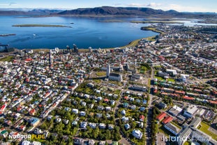 Capture the mesmerizing aerial view of Reykjavik from this exhilarating helicopter tour.
