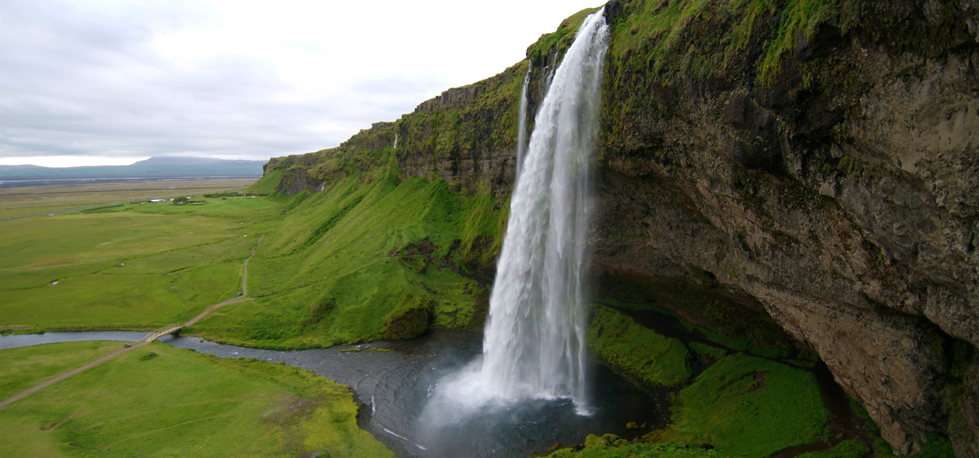 Seljalandsfoss waterfall boasts unbeatable natural beauty and has a path encircling it.