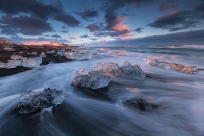 The Diamond Beach in Iceland has beautiful contrasts between its white ice and black sands.