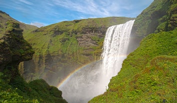 A rainbow showing over Skogafoss waterfall on the South Coast of Iceland.