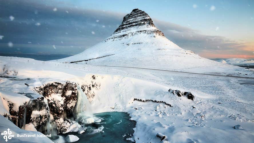 Snow covers Kirkjufell mountain during winter.