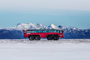 Embark on an epic journey across Langjokull Glacier, the second-largest glacier in Iceland, aboard this fierce red monster truck.