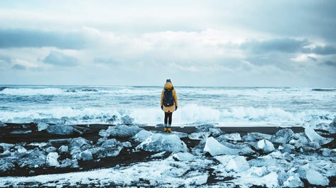 Sparkling beauty at Diamond Beach: Shimmering icebergs, carried from Jokulsarlon Glacier Lagoon, rest gracefully on the black sand shores, creating a mesmerizing contrast that earned this unique spot its name.