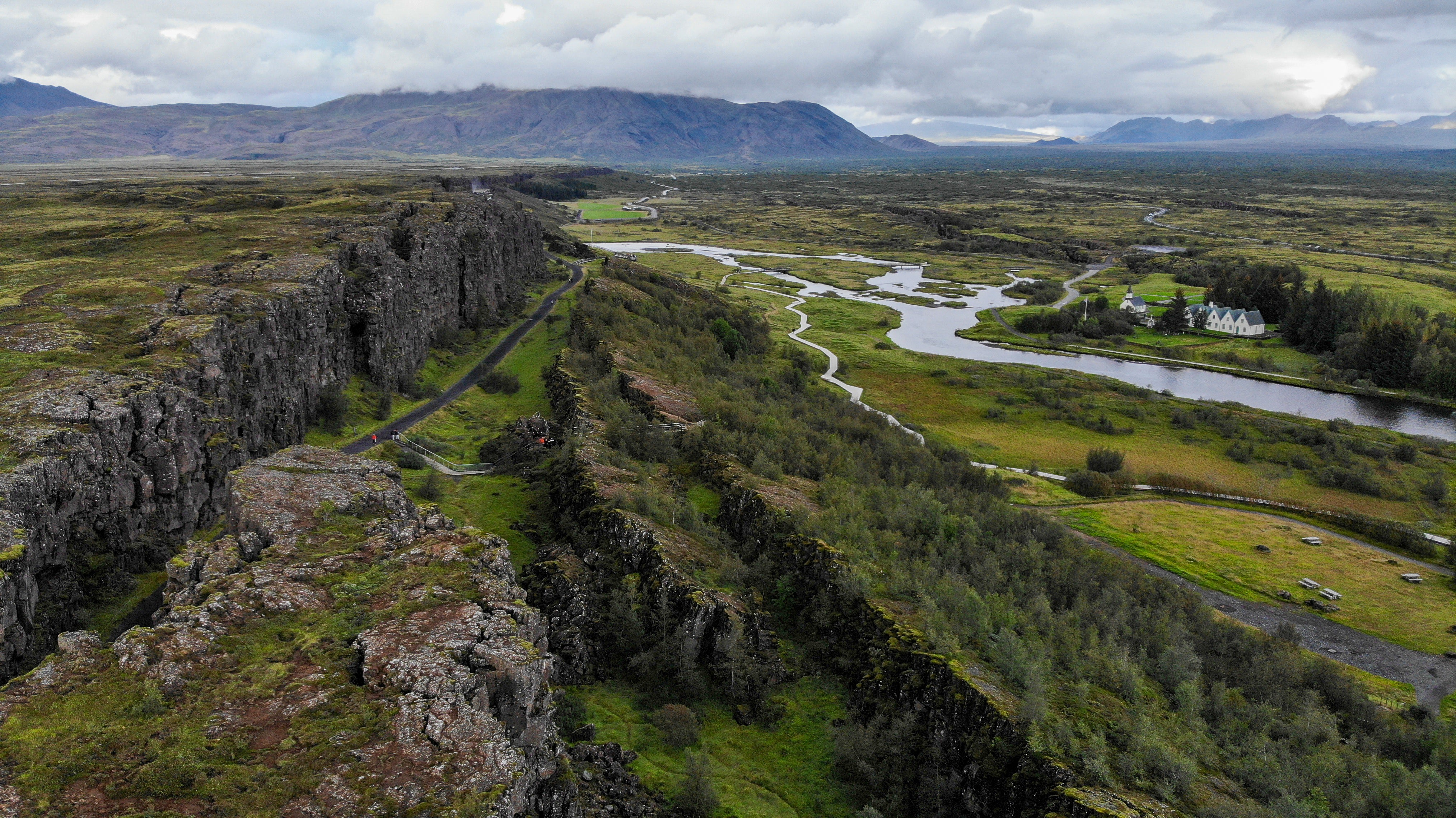 Thingvellir National Park boasts an enchanting landscape of lush greenery and geological wonders.