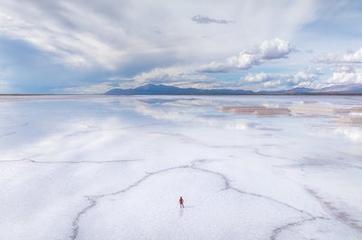 Clouds reflect in the salt flat of Sala de Arizaro.